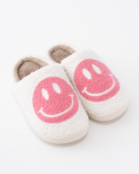 fuzzy white house slippers with light pink smiley face 