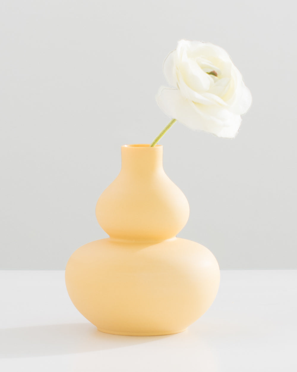 Yellow handmade porcelain vase with bubble design. 