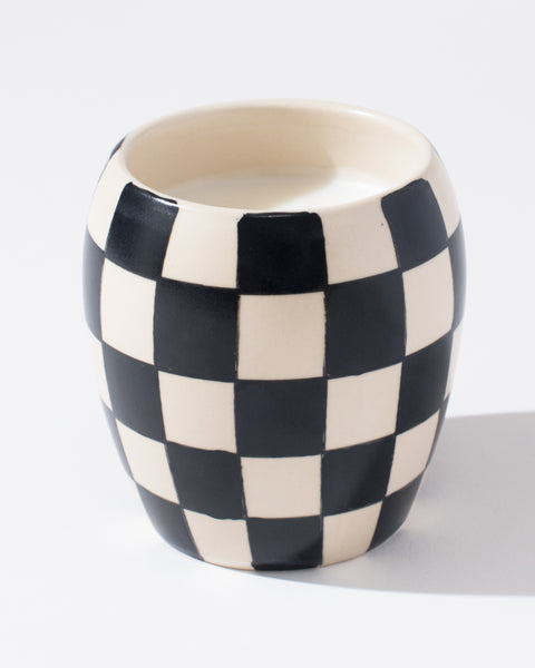 black and white checkered candle with soy olive and fig