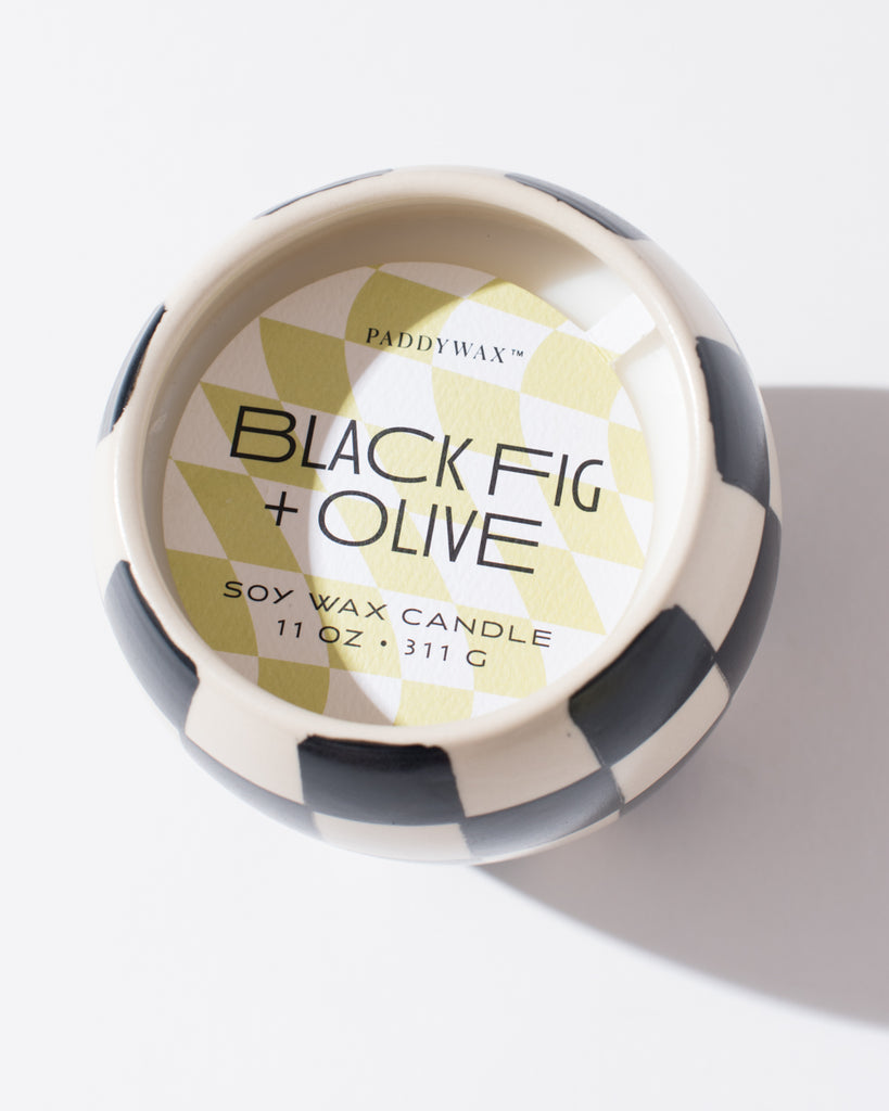 black and white checkered candle with soy olive and fig