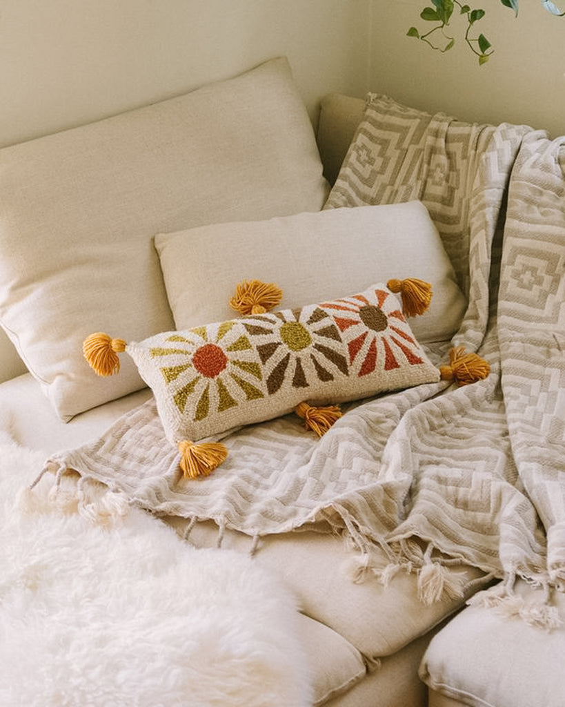 boho sunshine handmade hook pillow with warm colors and tassels