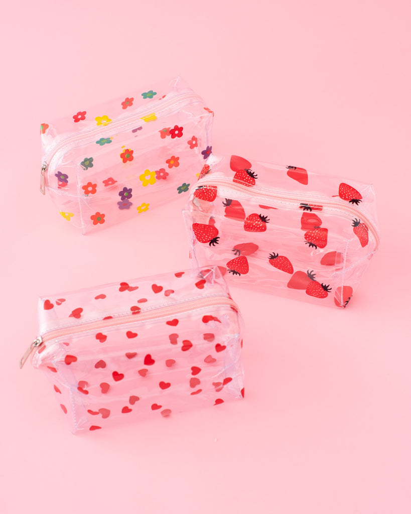 clear plastic square cosmetic bags with printed heart, strawberry, or daisy illustration