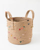boho jute basket with colorful fabric accents