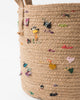 boho jute basket with colorful fabric accents