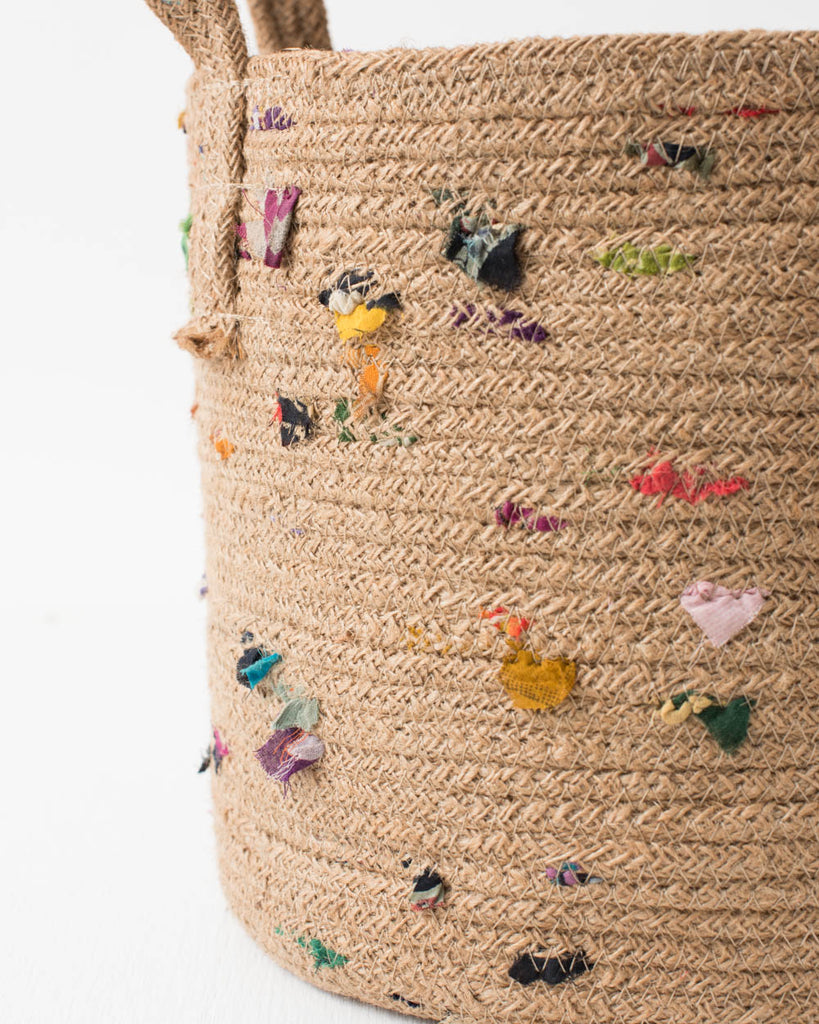 boho jute basket with colorful fabric accents