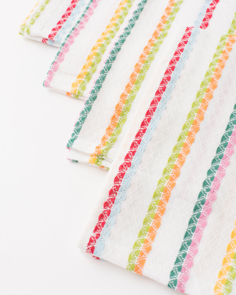 cloth napkins with stitched rainbow stripes