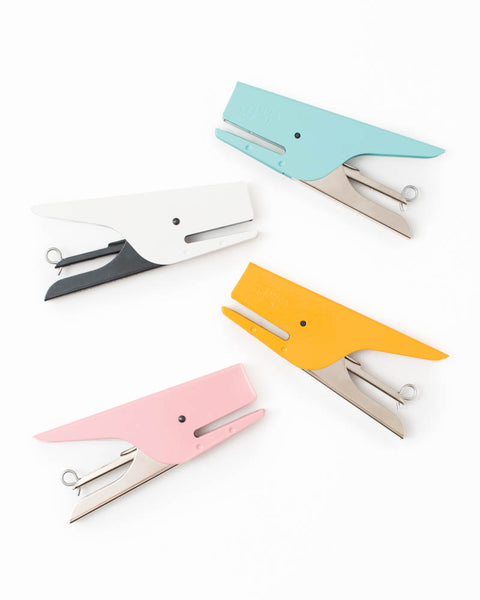pastel hand staplers blue white yellow and pink