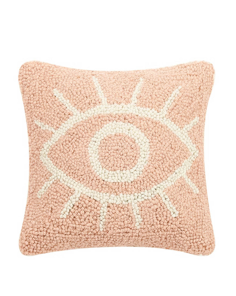 Pink handmade hook pillow with white eye design