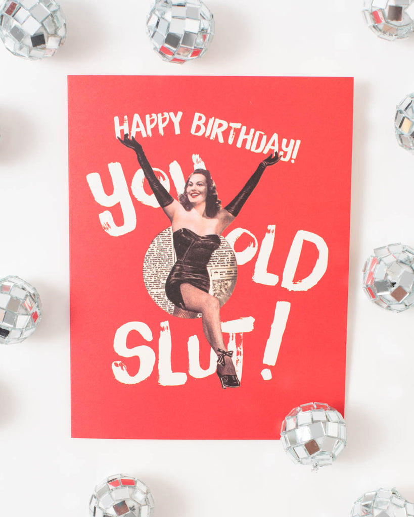 funny retro inspired birthday card with woman design and white text 'happy birthday you old slut'