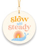 retro inspired groovy hanging air freshener with snail image and slow and steady retro text
