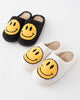black or white fuzzy smiley house slippers with yellow smiley face 