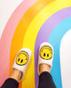 white fuzzy smiley face house slippers