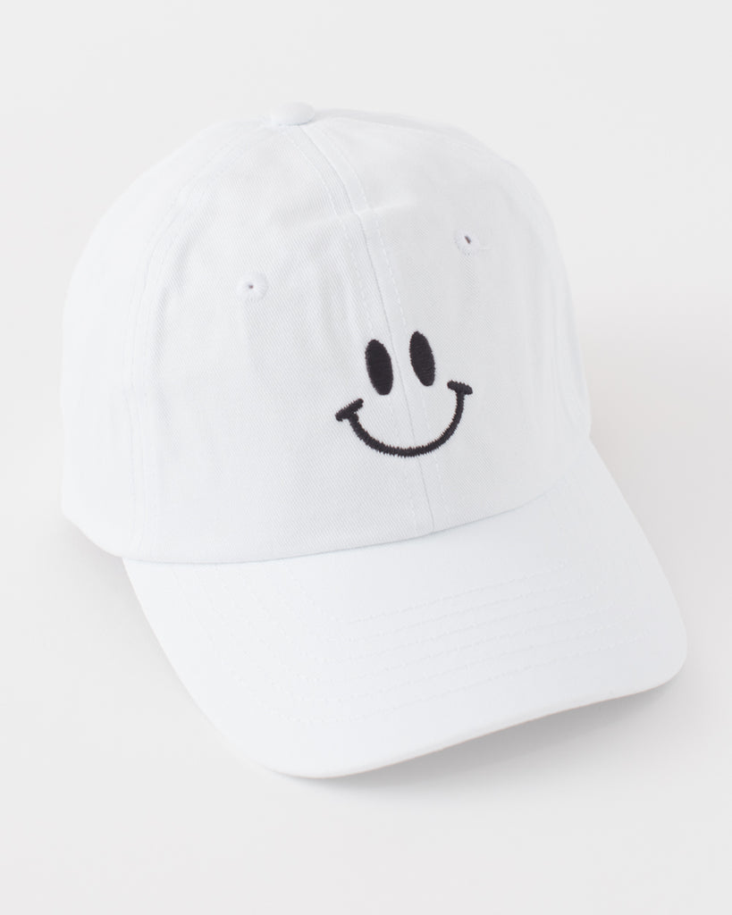 white ballcap style hat with black embroidered smiley face 