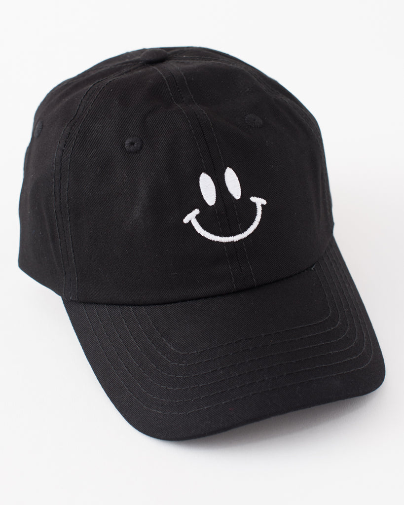 black baseball cap style hat with white embroidered smiley face
