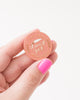 funny pink pin with white text 'stay sexy don't get murdered' gold accents and knife illustration
