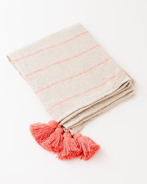 Boho throw blanket with pink woven stripes and tassels