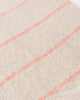 Boho throw blanket with pink woven stripes and tassels