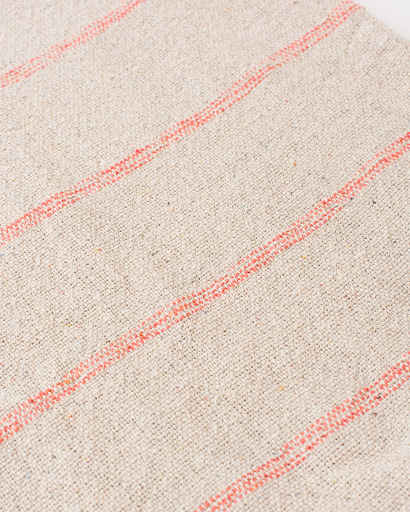 Boho throw blanket with pink woven stripes and tassels
