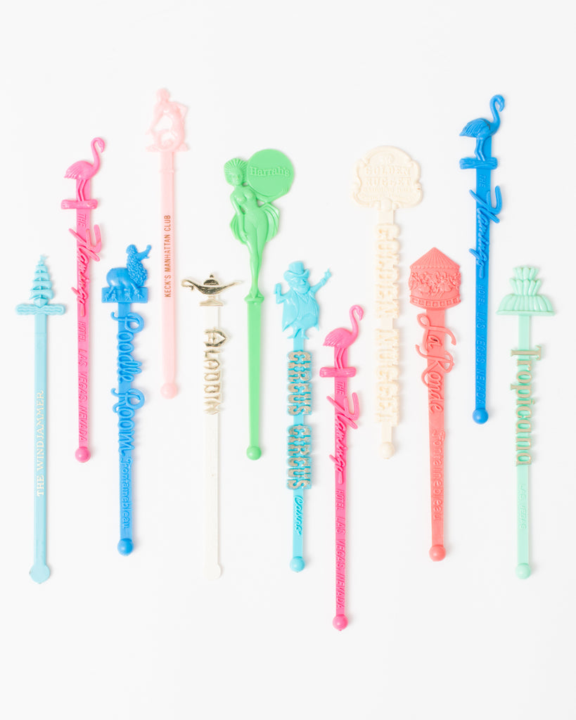 Vintage retro swizzle sticks drink stirrers in pastel colors. Designs from Las Vegas, Miami, and New York. Great for bar carts or tiki bars. 